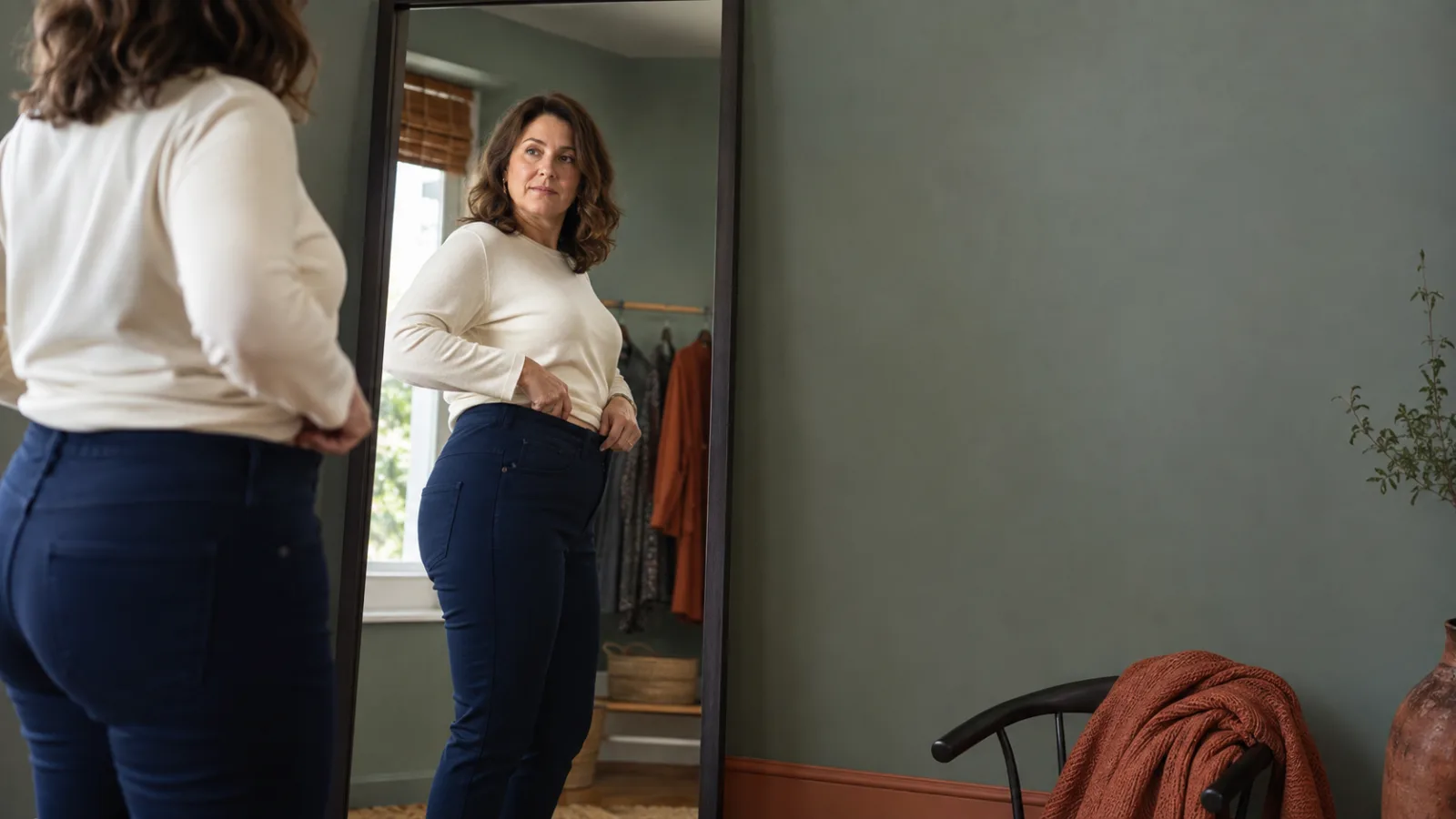A mature woman wearing plain stretch pants with no visible logos or brand marks