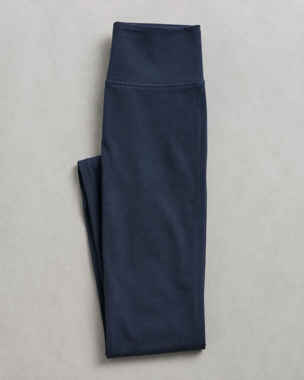 a pair of leggings folded in half lengthwise, side seam running down the frame with a high rise and a full elastic waistband , fabric: Pima cotton and modal knit (modal counted with rayon)
